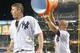 Jul 22, 2014; Bronx, NY, USA; New York Yankees left fielder Brett Gardner (11) dumps Gatorade on third baseman Chase Headley (12) after Headley's game-winning walk off single against the Texas Rangers during a game at Yankee Stadium. Mandatory Credit: Brad Penner-USA TODAY Sports