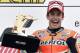 First placed Marc Marquez from Spain lifts his trophy during the award ceremony for the MotoGP race at the Sachsenring circuit in Hohenstein-Ernstthal, Germany, Sunday, July 13, 2014. (AP Photo/Jens Meyer)