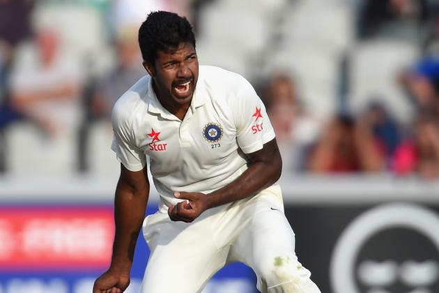 MANCHESTER, ENGLAND - AUGUST 07:  India bowler Varun Aaron  celebrates after dismissing England batsman Gary Ballance during day one of the 4th Investec Test match between England and India at Old Trafford on August 7, 2014 in Manchester, England.  (Photo by Stu Forster/Getty Images)