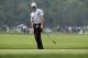 Rory McIlroy, of Northern Ireland, reacts after his chip to the fourth green during the second round of the PGA Championship golf tournament at Valhalla Golf Club on Friday, Aug. 8, 2014, in Louisville, Ky. (AP Photo/John Locher)