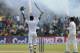 Sri Lankan batsman Kumar Sangakkara, left, celebrates scoring a double century as Pakistan's Saeed Ajmal applauds during the fourth day of the first test cricket match between Sri Lanka and Pakistan in Galle, Sri Lanka, Saturday, Aug. 9, 2014. (AP Photo/Eranga Jayawardena)