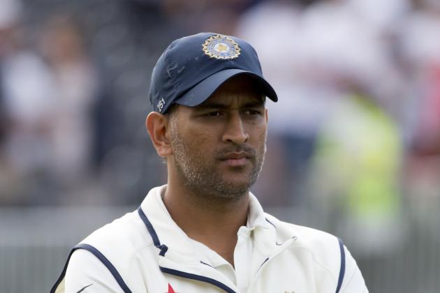 India's captain MS Dhoni stands on the pitch after his team's innings and 54 run loss to England on the third day of the fourth test match of their five match series at Old Trafford cricket ground, in Manchester, England, Saturday, Aug. 9, 2014. (AP Photo/Jon Super)