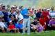 LOUISVILLE, KY - AUGUST 09: Rory McIlroy of Northern Ireland chips to the tenth green as a gallery of patrons look on during the third round of the 96th PGA Championship at Valhalla Golf Club on August 9, 2014 in Louisville, Kentucky. (Photo by Jeff Gross/Getty Images)