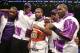 BROOKLYN, NY - AUGUST 9: Lamont Peterson (White w/Purple trunks) poses after his TKO win over Edgar Santana (not shown) in their IBF junior welterweight championship fight at the Barclays Center on August 9, 2014 in Brooklyn, New York. (Photo by Ed Mulholland/Getty Images)