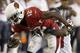 Arizona Cardinals' John Brown (12) gets tackled by Houston Texans' Josh Victorian (27) after Brown made a catch during the first half of an NFL football game Saturday, Aug. 9, 2014, in Glendale, Ariz. (AP Photo/Ross D. Franklin)