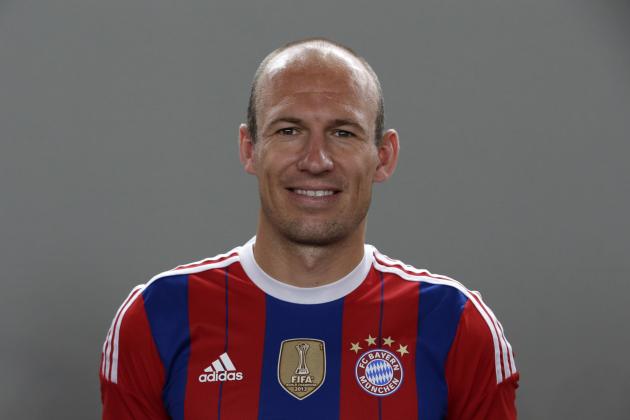 Bayern Munich's Arjen Robben of the Netherlands poses during an official photo shooting for the new German first division Bundesliga season, in Munich, southern Germany, Saturday, Aug. 9, 2014. (AP Photo/Matthias Schrader)