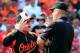BALTIMORE, MD - AUGUST 10: Manager Buck Showalter of the Baltimore Orioles argues with second base umpire Jeff Nelson after being ejected during the sixth inning against the St. Louis Cardinals at Oriole Park at Camden Yards on August 10, 2014 in Baltimore, Maryland. The Cardinals won 8-3. (Photo by Rob Carr/Getty Images)