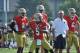 Notre Dame quarterback Everett Golson works on footwork as quarterback's coach Matt LaFleur, right, and quarterback Malik Zaire, left, look on Saturday Aug. 9, 2014 in South Bend, Ind. Notre Dame opens the season against Rice at home Saturday Aug. 30. (AP Photo/Joe Raymond)