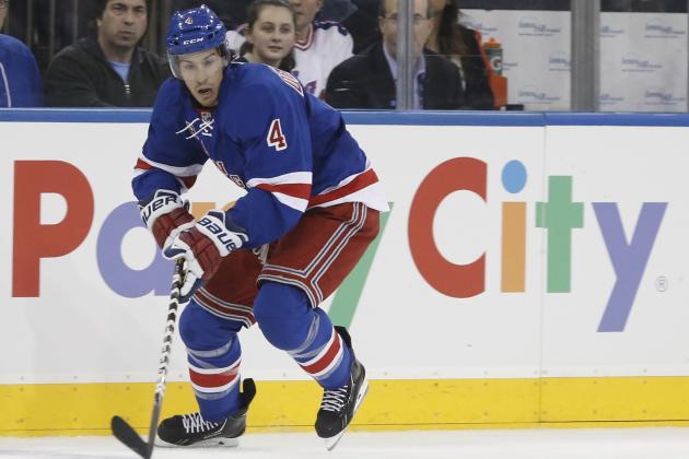 New York Rangers defenseman Michael Del Zotto (4) skates with the puck in the second period of their NHL hockey game at Madison Square Garden in New York, Monday, Oct. 28, 2013. (AP Photo/Kathy Willens)