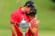 GREENSBORO, NC - AUGUST 18: (L-R) Patrick Reed and his wife Justine celebrate after defeating Jordan Spieth on the second hole of a playoff during the final round of the Wyndham Championship at Sedgefield Country Club on August 18, 2013 in Greensboro, North Carolina. (Photo by Tyler Lecka/Getty Images)
