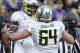 Oregon running back Byron Marshall, left, celebrates his touchdown against Washington with Tyler Johnstone (64) in the first half of an NCAA college football game, Saturday, Oct. 12, 2013, in Seattle. (AP Photo/Elaine Thompson)
