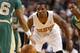 Phoenix Suns guard Eric Bledsoe plays defense against the Boston Celtics during the second half of the Suns 87-80 win in an NBA basketball game in Boston Friday, March 14, 2014. (AP Photo/Winslow Townson)