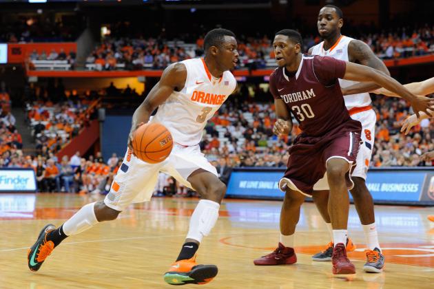 SYRACUSE, NY - NOVEMBER 12: Jerami Grant #3 of the Syracuse Orange drives to the basket around Ryan Rhoomes #30 of the Fordham Rams during the first half at the Carrier Dome on November 12, 2013 in Syracuse, New York. (Photo by Rich Barnes/Getty Images)