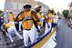 Members of the Jackie Robinson West Little League team from Chicago, Ill., ride in the Little League Grand Slam Parade as it makes its way through downtown Williamsport, Pa., Wednesday, Aug. 13, 2014. The Little League World Series tournament begins Thursday, August 14, in South Williamsport, Pa.. (AP Photo/Gene J. Puskar)