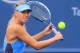 Maria Sharapova, of Russia, returns a volley to Madison Keys at the Western & Southern Open tennis tournament, Tuesday, Aug. 12, 2014, in Mason, Ohio. (AP Photo/Tom Uhlman)