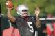 Ohio State quarterback Braxton Miller warms up during an NCAA college football practice Saturday, Aug. 9, 2014, in Columbus, Ohio. (AP Photo/Jay LaPrete)