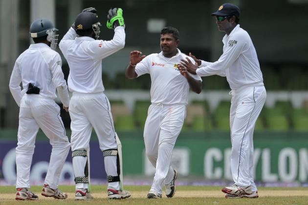 Sri Lankan bowler Rangana Herath, second right, celebrates with teammates the dismissal of Pakistan's Khurram Manzoor during the second day of the second test cricket match between Sri Lanka and Pakistan in Colombo, Sri Lanka, Friday, Aug. 15, 2014. (AP Photo/Eranga Jayawardena)