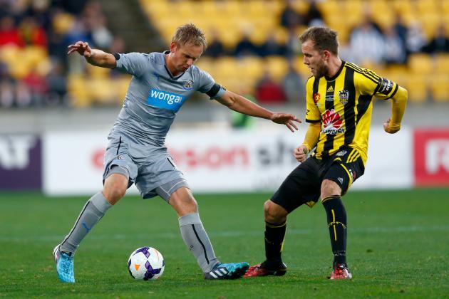 WELLINGTON, NEW ZEALAND - JULY 26: Siem De Jong of Newcastle looks for a way around Jeremy Brockie of the Phoenix during the Football United New Zealand Tour match between the Wellington Phoenix and Newcastle United at Westpac Stadium on July 26, 2014 in Wellington, New Zealand. (Photo by Phil Walter/Getty Images)