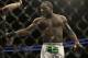 Anthony Johnson is pushed away by referee Herb Dean after beating Antonio Rogerio Nogueira by technical knockout during a light heavyweight mixed martial arts bout at a UFC on Fox event in San Jose, Calif., Saturday, July 26, 2014. Johnson won by technical knockout. (AP Photo/Jeff Chiu)