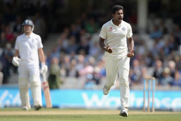 LONDON, ENGLAND - AUGUST 16: Varun Aaron of India celebrates dismissing England captain Alastair Cook during day two of 5th Investec Test match between England and India at The Kia Oval on August 16, 2014 in London, England. (Photo by Gareth Copley/Getty Images)