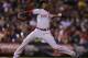 Cincinnati Reds relief pitcher Aroldis Chapman throws against the Colorado Rockies during the ninth inning of a baseball game on Friday, Aug. 15, 2014, in Denver. (AP Photo/Jack Dempsey)