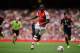 Arsenal's Yaya Sanogo runs with the ball during the Emirates Cup soccer match between between Arsenal and Benfica at Arsenal's Emirates Stadium in London, Saturday, Aug. 2, 2014. (AP Photo/Matt Dunham)