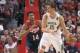 United States' Anthony Davis (14), of the New Orleans Pelicans defends against Brazil's Tiago Splitter (15), of the San Antonio Spurs, during an exhibition game between the US and Brazilian national teams Saturday, Aug. 16, 2014, in Chicago. (AP Photo/Charles Rex Arbogast)