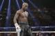Floyd Mayweather Jr. stands in the ring during his WBC-WBA welterweight title boxing fight against Marcos Maidana Saturday, May 3, 2014, in Las Vegas. (AP Photo/Isaac Brekken)