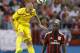 Liverpool's Martin Skrtel (37) aims his header away from AC Milan's Mario Balotelli (45) during a Guinness International Champions Cup soccer match in Charlotte, N.C., Saturday, Aug. 2, 2014. Liverpool won 2-0. (AP Photo/Bob Leverone)