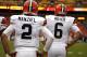 Cleveland Browns quarterbacks Johnny Manziel, left, and Brian Hoyer warm up before an NFL preseason football against the Washington Redskins on Monday, Aug. 18, 2014, in Landover, Md. (AP Photo/Evan Vucci)