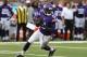 Minnesota Vikings quarterback Teddy Bridgewater (5) rolls out against the Oakland Raiders in the first half of a preseason NFL football game in Minneapolis, Friday, Aug. 8, 2014. (AP Photo/Jim Mone)