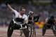 Britain's Mickey Bushell celebrates winning the men's 100m T53 event at the 2012 Paralympics, Monday, Sept. 3, 2012, in London. (AP Photo/Kirsty Wigglesworth)