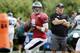 Philadelphia Eagles quarterback Nick Foles fades back to throw as head coach Chip Kelly, right, stands near during an NFL Football training camp scrimmage of the New England Patriots and Eagles in Foxborough, Mass., Tuesday, Aug. 12, 2014. (AP Photo/Charles Krupa)