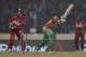 Bangladesh batsman Shakib Al Hasan, center, is bowled out by West Indies' bowler Krishmar Santokie during their ICC Twenty20 Cricket World Cup match in Dhaka, Bangladesh, Tuesday, March 25, 2014. (AP Photo/Aijaz Rahi)