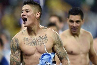 Can you identify the footballer from their tattoo?
