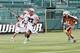 ROCHESTER, NY - JUNE 29: Ken Clausen #27 of the Denver Outlaws carries the ball against Mark Cockerton #41 of the Rochester Rattlers at Sahlen's Stadium on June 29, 2014 in Rochester, New York. Rochester defeated Denver 19-14. (Photo by Jen Fuller/Getty Images)