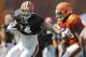 Cleveland Browns tight end Jordan Cameron, left, fights past linebacker Christian Kirksey during practice at NFL football training camp in Berea, Ohio Friday, Aug. 15, 2014. (AP Photo/Mark Duncan)