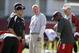 Nebraska head coach Bo Pelini, center, laughs with members of his staff during team practice in Lincoln, Neb., Wednesday, Aug. 13, 2014. (AP Photo/Nati Harnik)