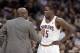 Cleveland Cavaliers coach Mike Brown, left, talks to Anthony Bennett during the third quarter of an NBA basketball game against the San Antonio Spurs on Tuesday, March 4, 2014, in Cleveland. San Antonio won 122-101. (AP Photo/Mark Duncan)
