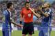 Argentina's Javier Mascherano (14) and Lionel Messi argue with referee Nicola Rizzoli from Italy after Gonzalo Higuain collided with Germany's goalkeeper Manuel Neuer during the World Cup final soccer match between Germany and Argentina at the Maracana Stadium in Rio de Janeiro, Brazil, Sunday, July 13, 2014. (AP Photo/Natacha Pisarenko)