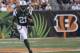 New York Jets running back Chris Johnson (21) runs against the Cincinnati Bengals in the first half of an NFL preseason football game, Saturday, Aug. 16, 2014, in Cincinnati. (AP Photo/Tony Tribble)