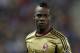 AC Milan's Mario Balotelli walks on the field during a Champions League, round of 16, second leg, soccer match between Atletico Madrid and AC Milan at the Vicente Calderon stadium in Madrid, Tuesday March 11, 2014. (AP Photo/Paul White)