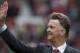 Manchester United's new manager Louis van Gaal waves to supporters before his team's English Premier League soccer match against Swansea City at Old Trafford Stadium, Manchester, England, Saturday Aug. 16, 2014. (AP Photo/Jon Super)