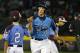 Las Vegas' Brennan Holligan (27) is greeted by Philadelphia third baseman Jack Rice (2) as he rounds third after hitting a two-run home run off Philadelphia pitcher Carter Davis in sixth inning of a United States semi-final baseball game at the Little League World Series tournament in South Williamsport, Pa., Wednesday, Aug. 20, 2014. Las Vegas won 8-1. (AP Photo/Gene J. Puskar)