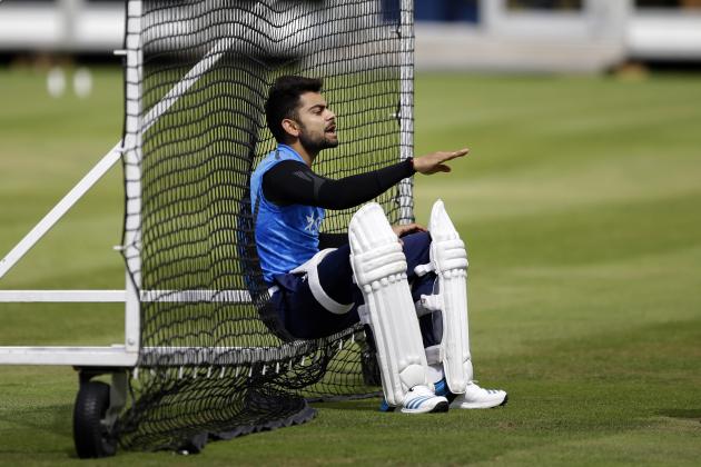 India's Virat Kohli speaks to a teammate as he waits his turn to bat in the nets during a training session at Lord's cricket ground in London, Tuesday, July 15, 2014. India are due to play England in the second cricket test match of the series at Lord's starting on Thursday. (AP Photo/Matt Dunham)