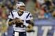 New England Patriots quarterback Tom Brady looks for a receiver against the Carolina Panthers defense in the first half of an NFL preseason football game Friday, Aug. 22, 2014, in Foxborough, Mass. (AP Photo/Charles Krupa)