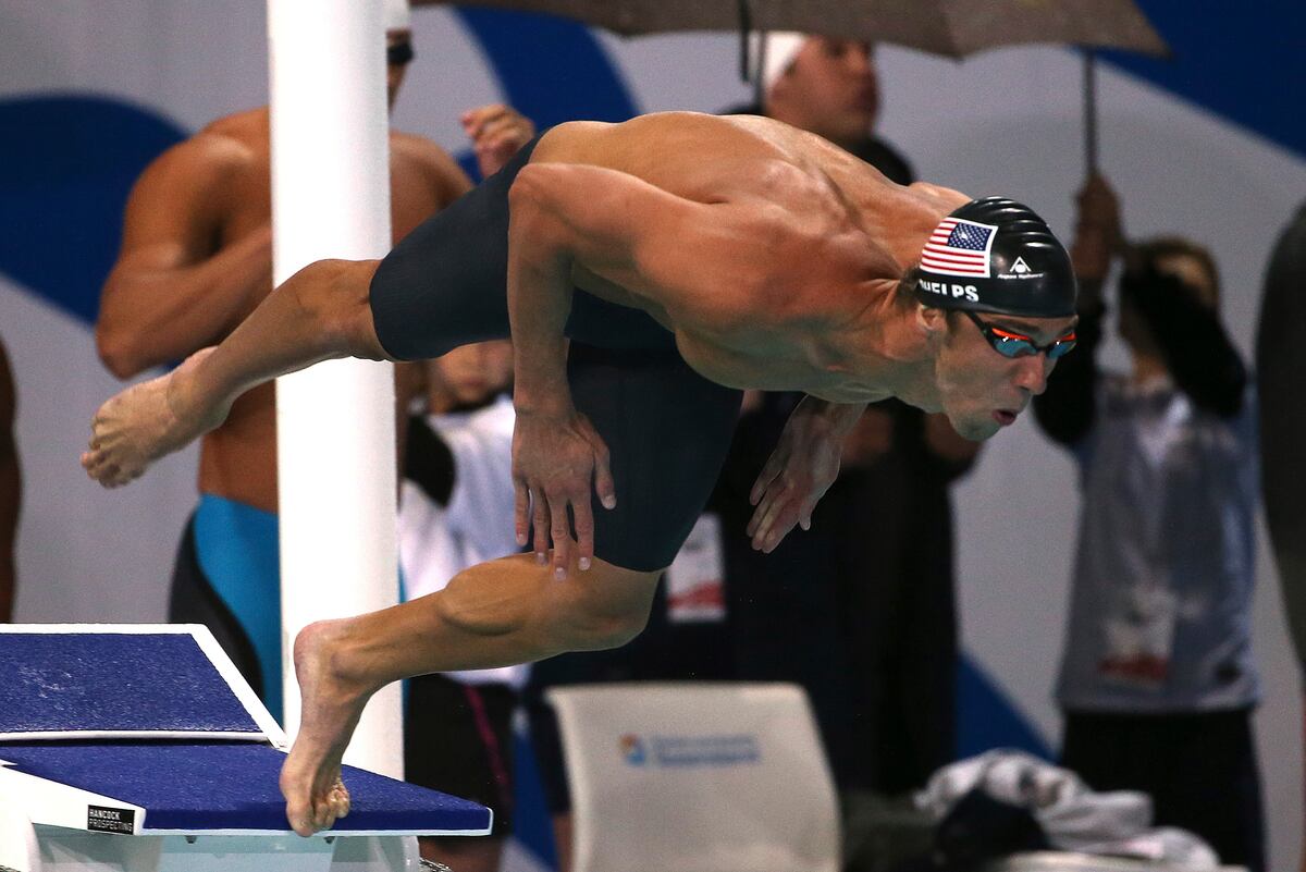 Michael Phelps Wins Gold in 100Meter Butterfly at Pan Pacific