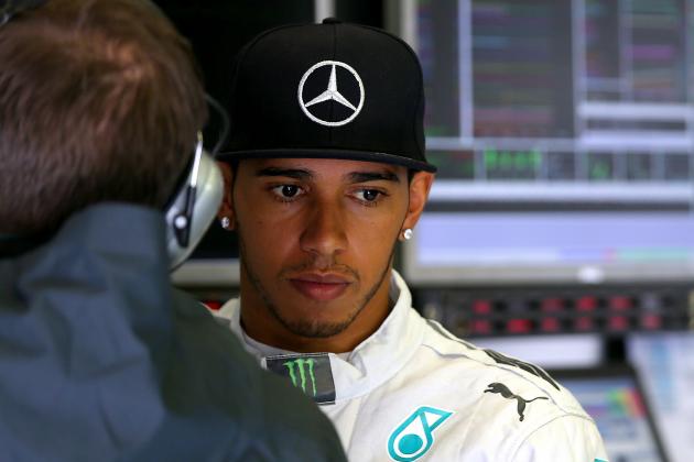 SPA, BELGIUM - AUGUST 23: Lewis Hamilton of Great Britain and Mercedes GP looks on in the garage during qualifying ahead of the Belgian Grand Prix at Circuit de Spa-Francorchamps on August 23, 2014 in Spa, Belgium. (Photo by Mark Thompson/Getty Images)
