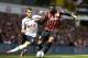 Tottenham Hotspur's Erik Lamela, left, competes for the ball with Queens Park Rangers' Armand Traore during their English Premier League soccer match at White Hart Lane, London, Sunday, Aug. 24, 2014. (AP Photo/Sang Tan)