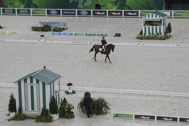 Carl Hester of Britain, riding Nip Tuck during the first day of Dressage team competition at the FEI World Equestrian Games, at Michel d'Ornano stadium in Cean, western France, Monday, Aug. 25, 2014. (AP Photo/Michel Euler)